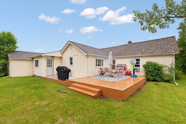 1104 Sunset Dr, Tecumseh, MI 49286 - rear view of property with a lawn, a wooden deck, and a shingled roof