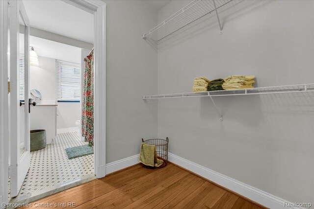 15 E Kirby St Unit 304, Detroit, MI 48202 - laundry room with wood finished floors and baseboards