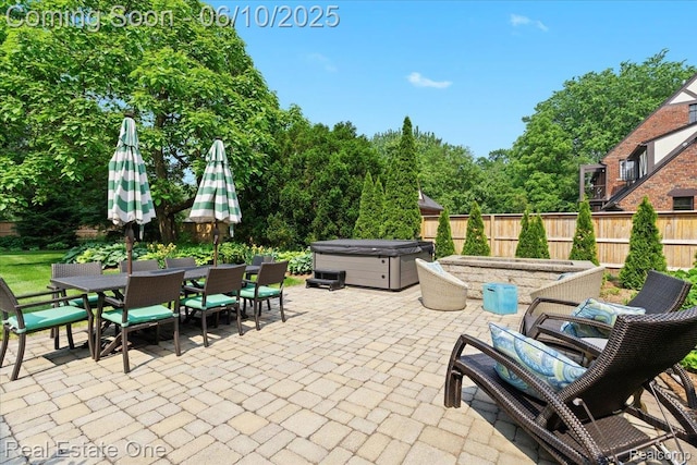22 Elm Park Blvd, Pleasant Ridge, MI 48069 - fenced backyard with a hot tub, a patio area, and outdoor dining area
