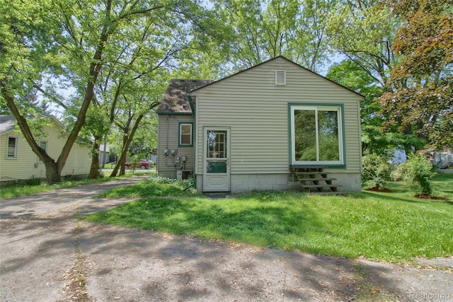 21248 Hamilton Ave, Farmington Hills, MI 48336 - view of side of property featuring entry steps and a lawn