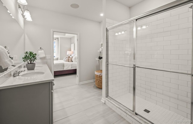 3013 Sheffield Cir, Clarkston, MI 48346 - bathroom featuring ensuite bathroom, double vanity, a stall shower, and baseboards