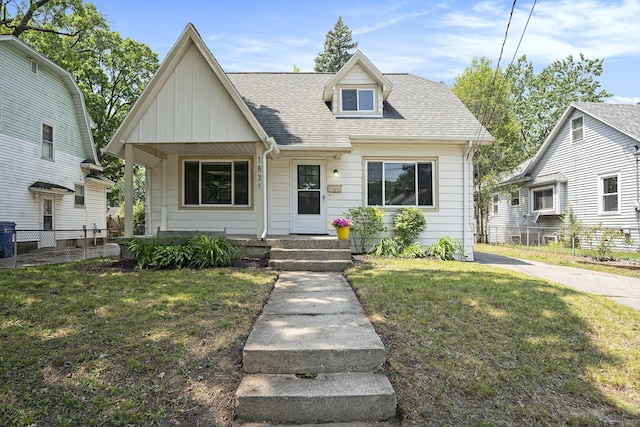 1831 Newark Ave SE, Grand Rapids, MI 49507 - view of front facade with a shingled roof and board and batten siding
