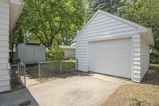 1831 Newark Ave SE, Grand Rapids, MI 49507 - detached garage featuring concrete driveway and cooling unit