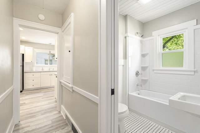1831 Newark Ave SE, Grand Rapids, MI 49507 - full bath featuring plenty of natural light, shower / bath combination, toilet, and vanity