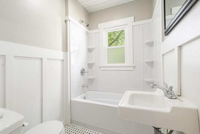 1831 Newark Ave SE, Grand Rapids, MI 49507 - bathroom featuring toilet, washtub / shower combination, and a sink