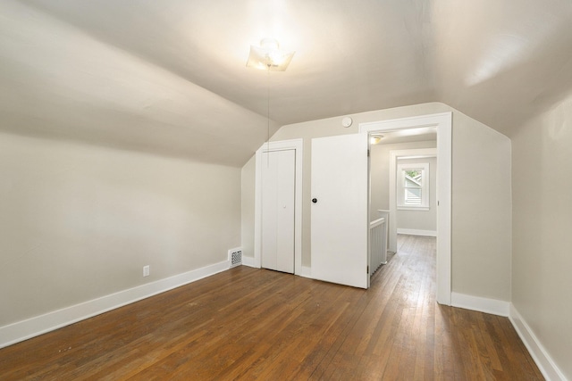 1831 Newark Ave SE, Grand Rapids, MI 49507 - additional living space with wood-type flooring, lofted ceiling, and baseboards