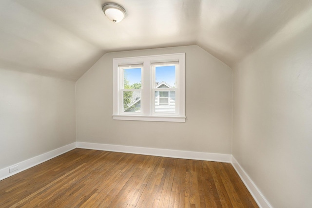 1831 Newark Ave SE, Grand Rapids, MI 49507 - bonus room with hardwood / wood-style floors, vaulted ceiling, and baseboards