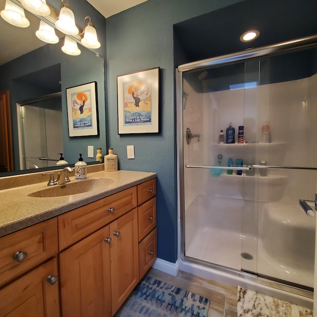 144 Dunkley Ave Unit 4, South Haven, MI 49090 - bathroom with vanity, a shower stall, and baseboards