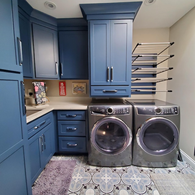 144 Dunkley Ave Unit 4, South Haven, MI 49090 - washroom featuring washer and clothes dryer, cabinet space, and tile patterned floors