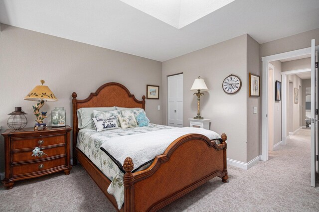 144 Dunkley Ave Unit 4, South Haven, MI 49090 - bedroom with light colored carpet, a skylight, and a closet