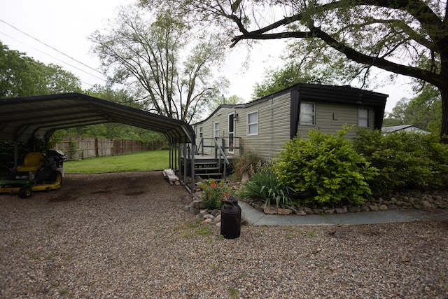 425 Clinton St, Mendon, MI 49072 - view of side of home featuring a detached carport