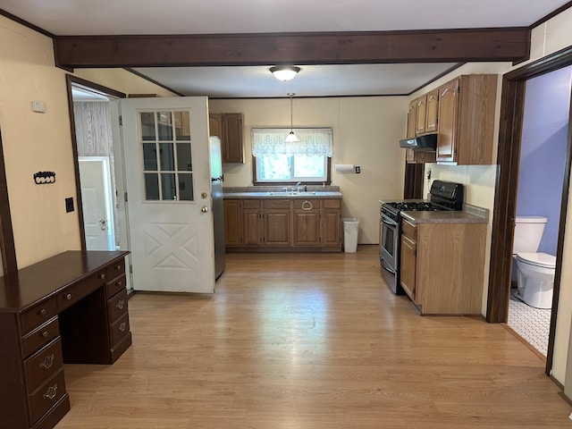 5649 W 76th St, Baldwin, MI 49304 - kitchen featuring stainless steel appliances, beam ceiling, under cabinet range hood, a sink, and dark countertops