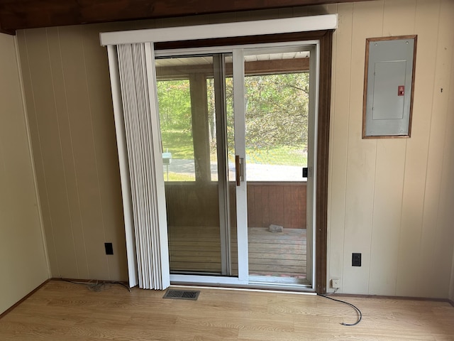 5649 W 76th St, Baldwin, MI 49304 - entryway with electric panel, healthy amount of natural light, and wood finished floors