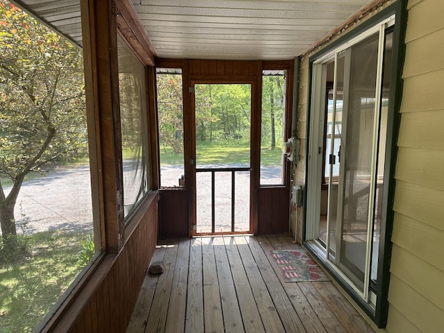 5649 W 76th St, Baldwin, MI 49304 - unfurnished sunroom featuring hardwood / wood-style flooring