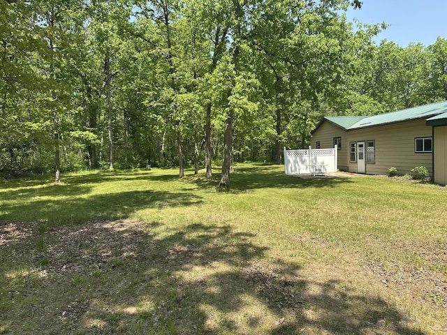 5649 W 76th St, Baldwin, MI 49304 - view of green lawn with a forest view