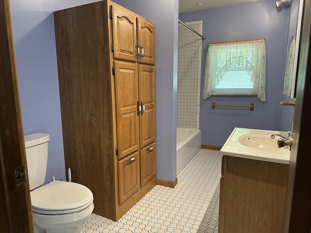 5649 W 76th St, Baldwin, MI 49304 - full bathroom featuring toilet, vanity, shower / bath combination, and baseboards