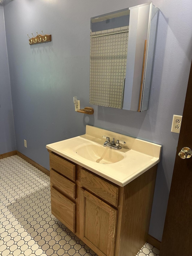 5649 W 76th St, Baldwin, MI 49304 - bathroom with vanity and baseboards