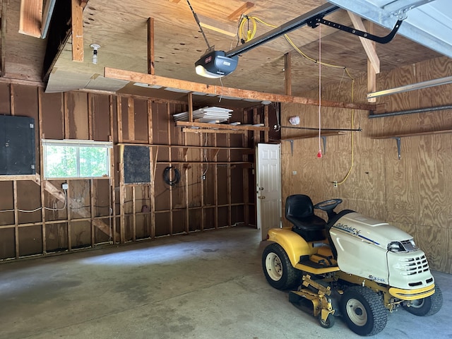 5649 W 76th St, Baldwin, MI 49304 - garage featuring a garage door opener and wooden walls