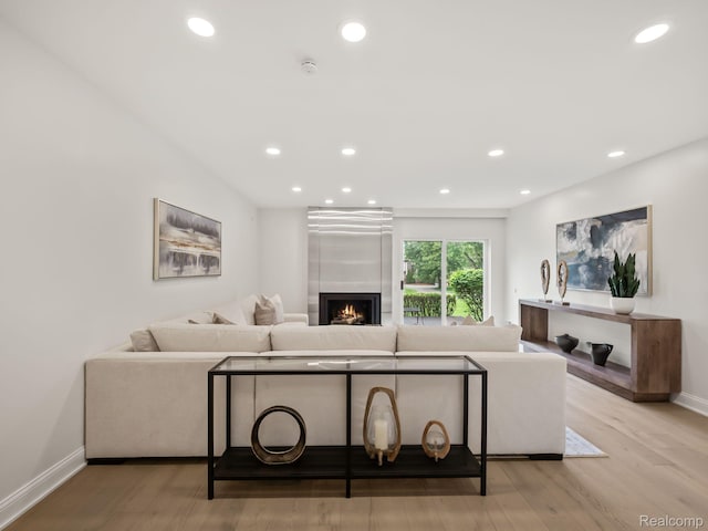 1756 Alexander Dr, Bloomfield Hills, MI 48302 - living room with wood finished floors, baseboards, a fireplace, and recessed lighting