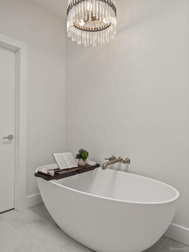 1756 Alexander Dr, Bloomfield Hills, MI 48302 - bathroom featuring a chandelier, a soaking tub, and baseboards