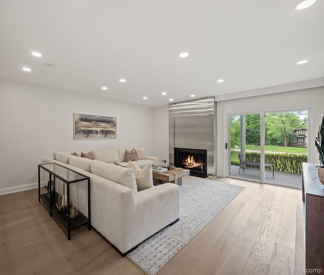 1756 Alexander Dr, Bloomfield Hills, MI 48302 - living room with wood finished floors, a fireplace, recessed lighting, and baseboards