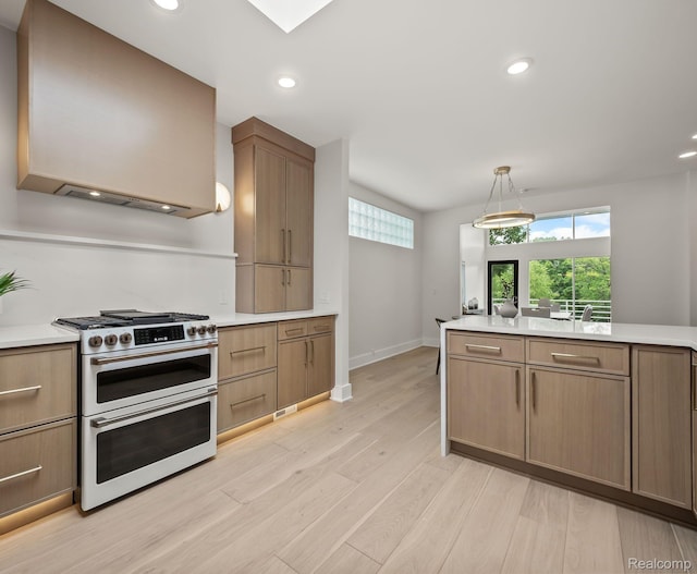 1756 Alexander Dr, Bloomfield Hills, MI 48302 - kitchen featuring range with two ovens, light wood finished floors, light countertops, custom range hood, and recessed lighting