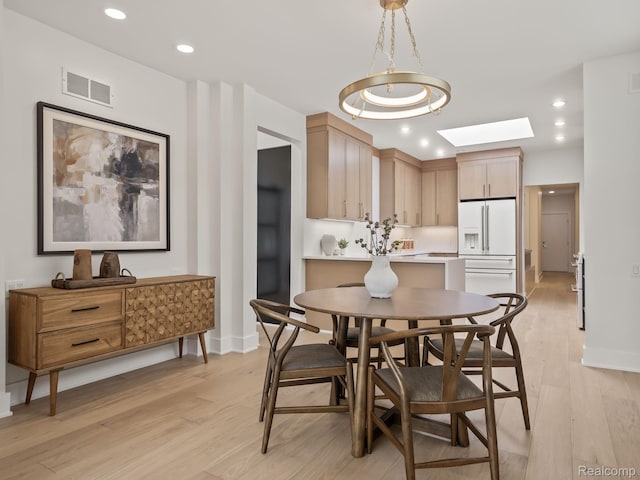 1756 Alexander Dr, Bloomfield Hills, MI 48302 - dining room featuring light wood-style flooring, a skylight, recessed lighting, and baseboards