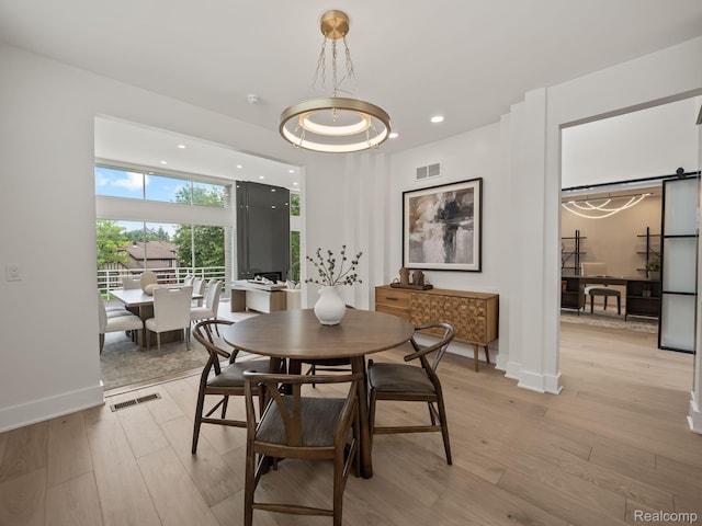 1756 Alexander Dr, Bloomfield Hills, MI 48302 - dining room featuring light wood-type flooring and baseboards
