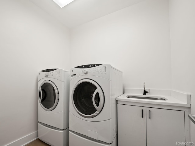 1756 Alexander Dr, Bloomfield Hills, MI 48302 - laundry area featuring washing machine and clothes dryer, cabinet space, and baseboards