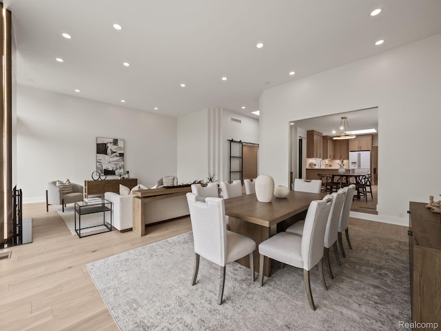 1756 Alexander Dr, Bloomfield Hills, MI 48302 - dining space featuring light wood finished floors, recessed lighting, and a barn door