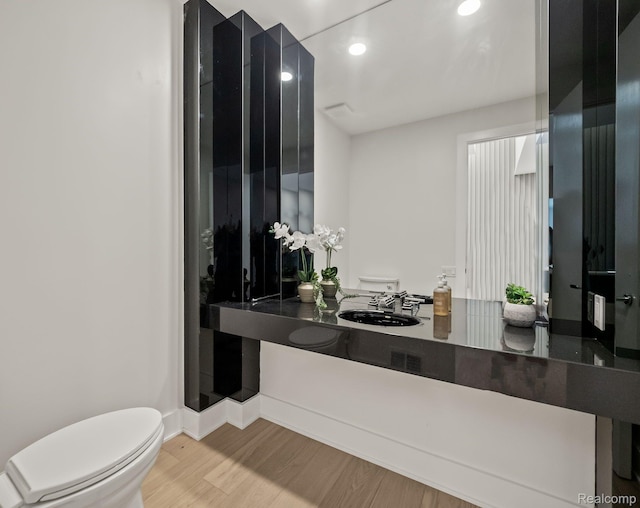 1756 Alexander Dr, Bloomfield Hills, MI 48302 - bathroom featuring toilet, wood finished floors, recessed lighting, baseboards, and vanity