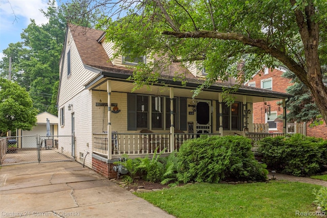 3128 Woodside Dr, Dearborn, MI 48124 - view of front of property featuring covered porch, a gate, and brick siding