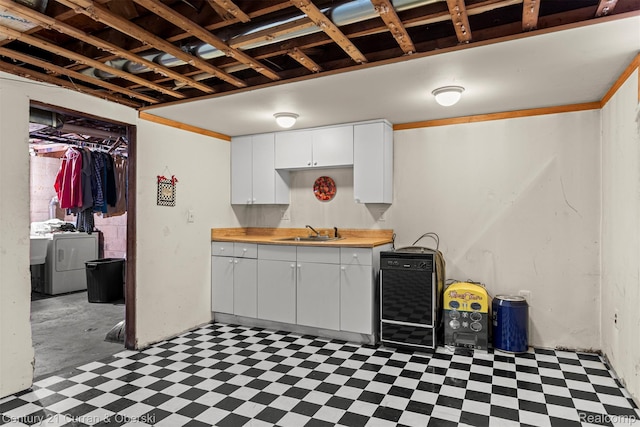 3128 Woodside Dr, Dearborn, MI 48124 - kitchen featuring tile patterned floors, a sink, washer / clothes dryer, white cabinets, and beverage cooler