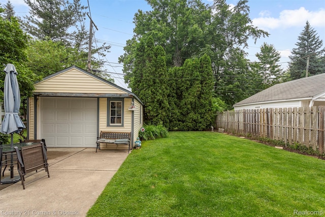 3128 Woodside Dr, Dearborn, MI 48124 - view of yard with a garage, an outbuilding, and driveway