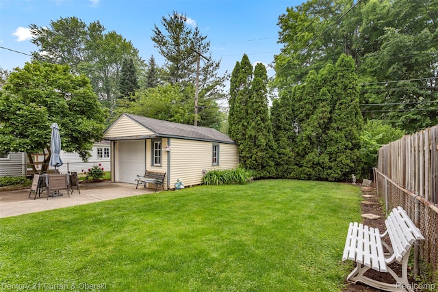3128 Woodside Dr, Dearborn, MI 48124 - view of yard featuring an outbuilding, a garage, and a patio area