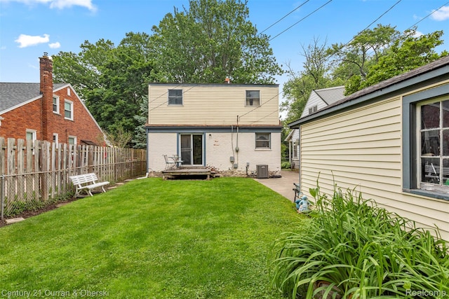 3128 Woodside Dr, Dearborn, MI 48124 - rear view of property featuring central AC unit and brick siding