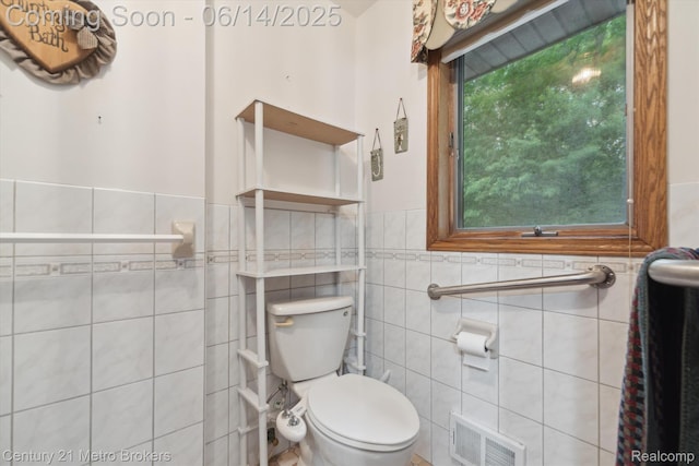 14210 W Burt Rd W, Chesaning, MI 48616 - half bath featuring tile walls and a wainscoted wall