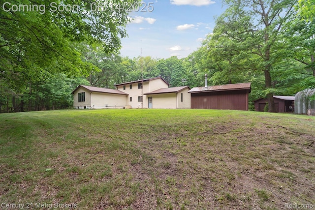 14210 W Burt Rd W, Chesaning, MI 48616 - back of house with a lawn