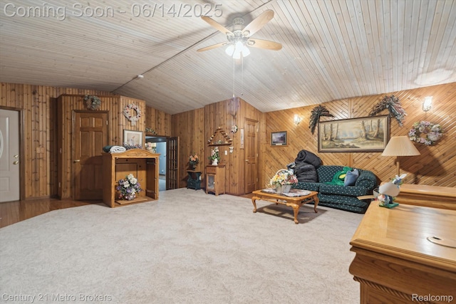 14210 W Burt Rd W, Chesaning, MI 48616 - living room with wooden walls, vaulted ceiling, ceiling fan, and carpet floors