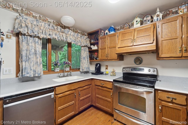 14210 W Burt Rd W, Chesaning, MI 48616 - kitchen with stainless steel appliances, open shelves, light countertops, and light wood finished floors