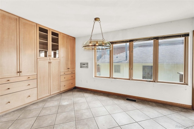 1870 Cass Lake Front Rd, Keego Harbor, MI 48320 - unfurnished dining area with baseboards and a chandelier