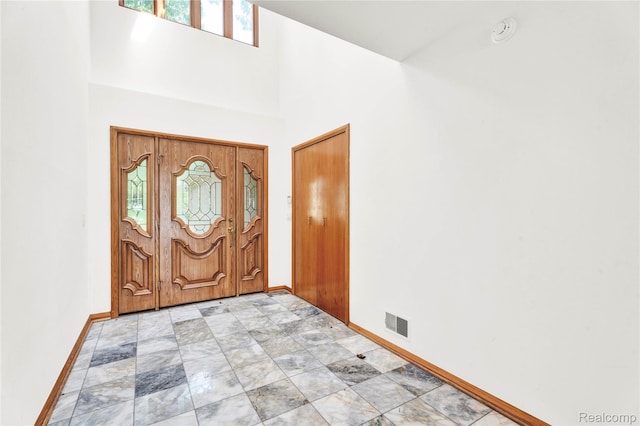 1870 Cass Lake Front Rd, Keego Harbor, MI 48320 - entrance foyer with baseboards and a towering ceiling