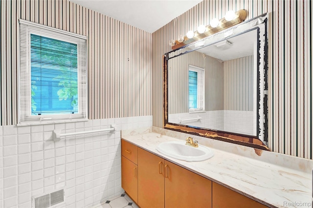 1870 Cass Lake Front Rd, Keego Harbor, MI 48320 - bathroom featuring wallpapered walls, vanity, and tile patterned flooring