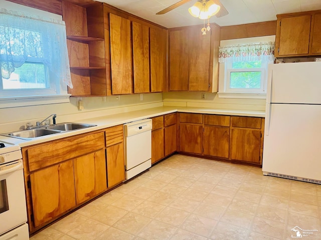 3421 3rd St, Trenton, MI 48183 - kitchen featuring white appliances, open shelves, light countertops, and brown cabinetry