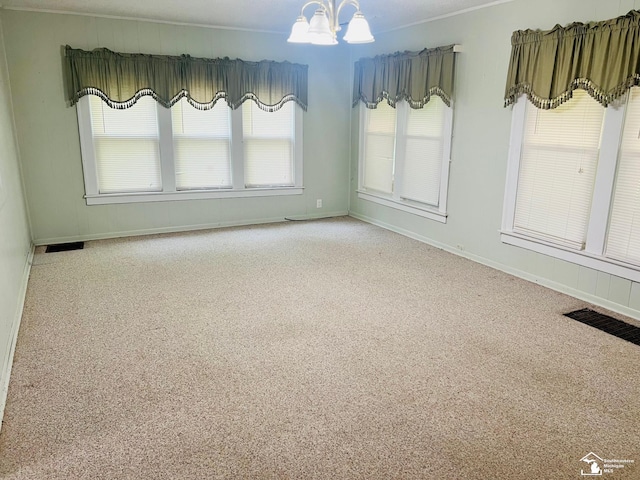 3421 3rd St, Trenton, MI 48183 - carpeted spare room with a chandelier, baseboards, and crown molding