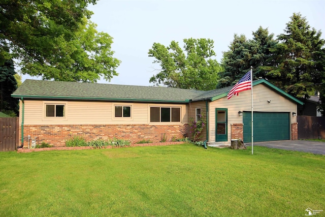 6336 Moreland Dr, Erie, MI 48133 - ranch-style home with brick siding, a garage, and asphalt driveway