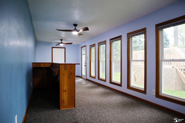6336 Moreland Dr, Erie, MI 48133 - unfurnished room featuring dark colored carpet, ceiling fan, and baseboards