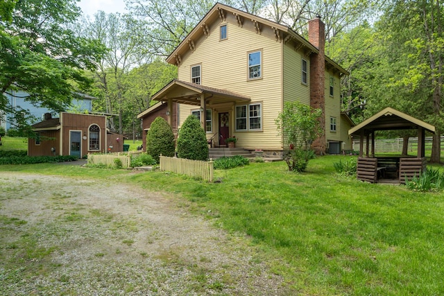 8425 Parshallville Rd, Fenton, MI 48430 - view of front facade featuring a chimney, a gazebo, driveway, and a front lawn