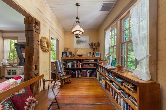 8425 Parshallville Rd, Fenton, MI 48430 - sitting room with wood-type flooring and wooden walls