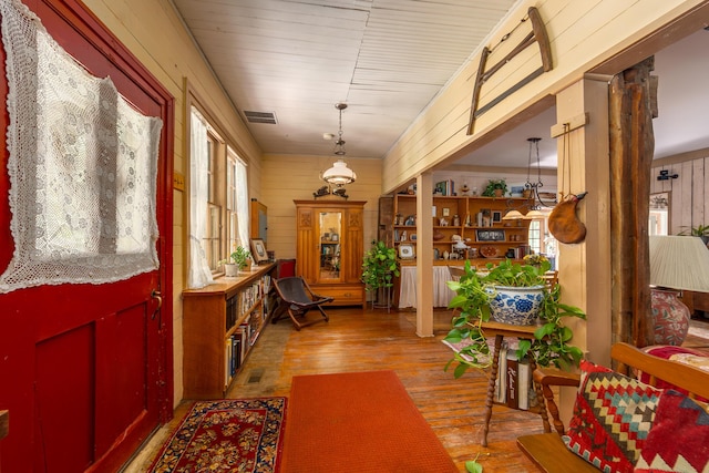 8425 Parshallville Rd, Fenton, MI 48430 - entrance foyer featuring wood walls and wood finished floors